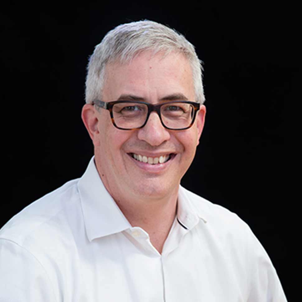 Matt Dawson headshot man in white collard shirt with brown glasses