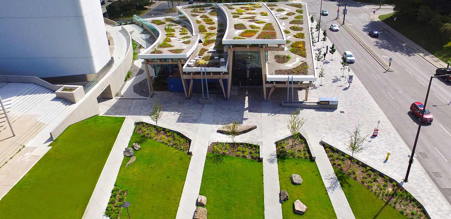 Ariel view of library with rooftop gardens and green grass