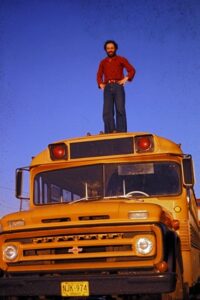 FORREC's Terry Brown standing on roof of school bus